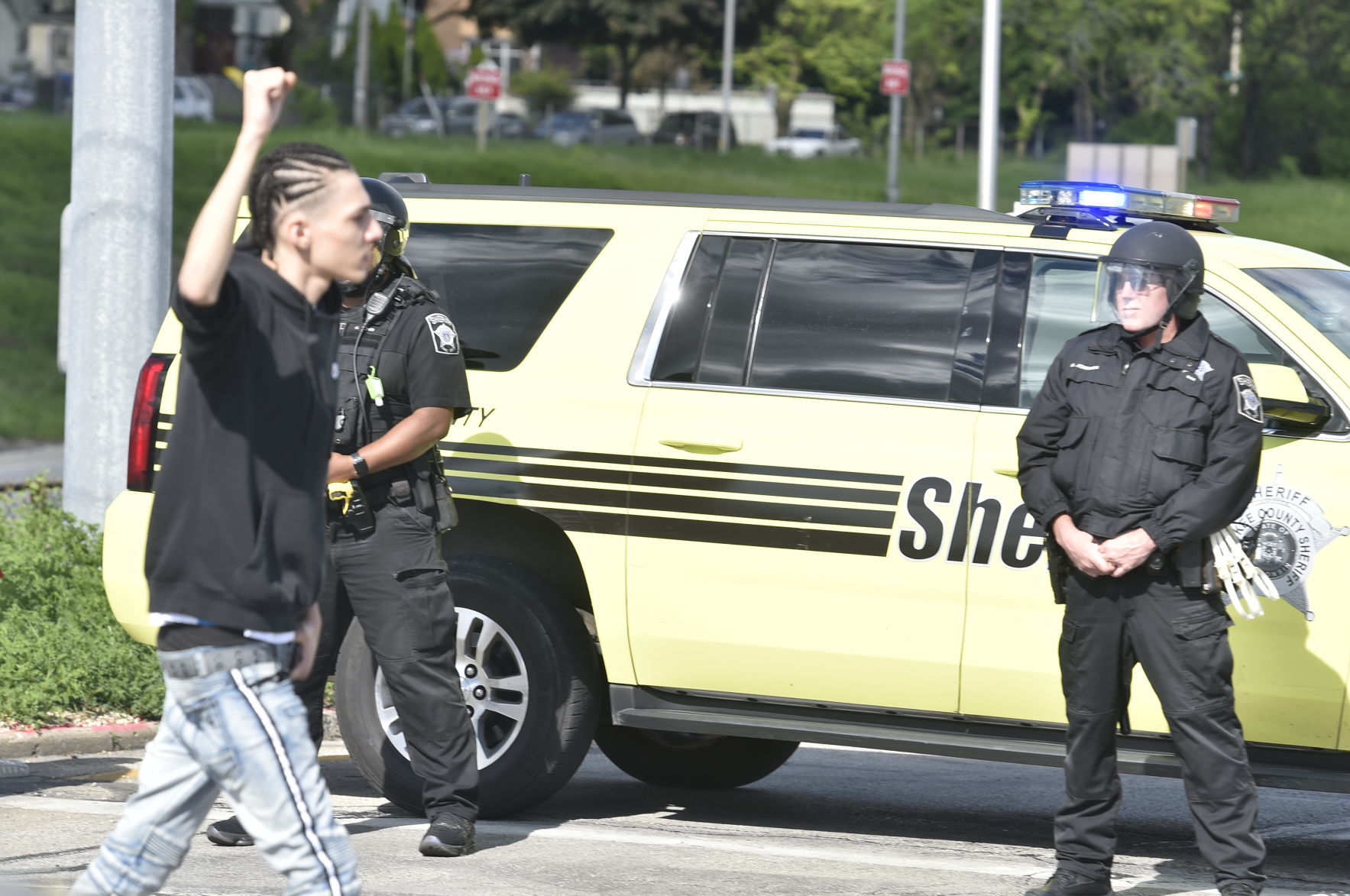 Protester stares down law enforcement officers